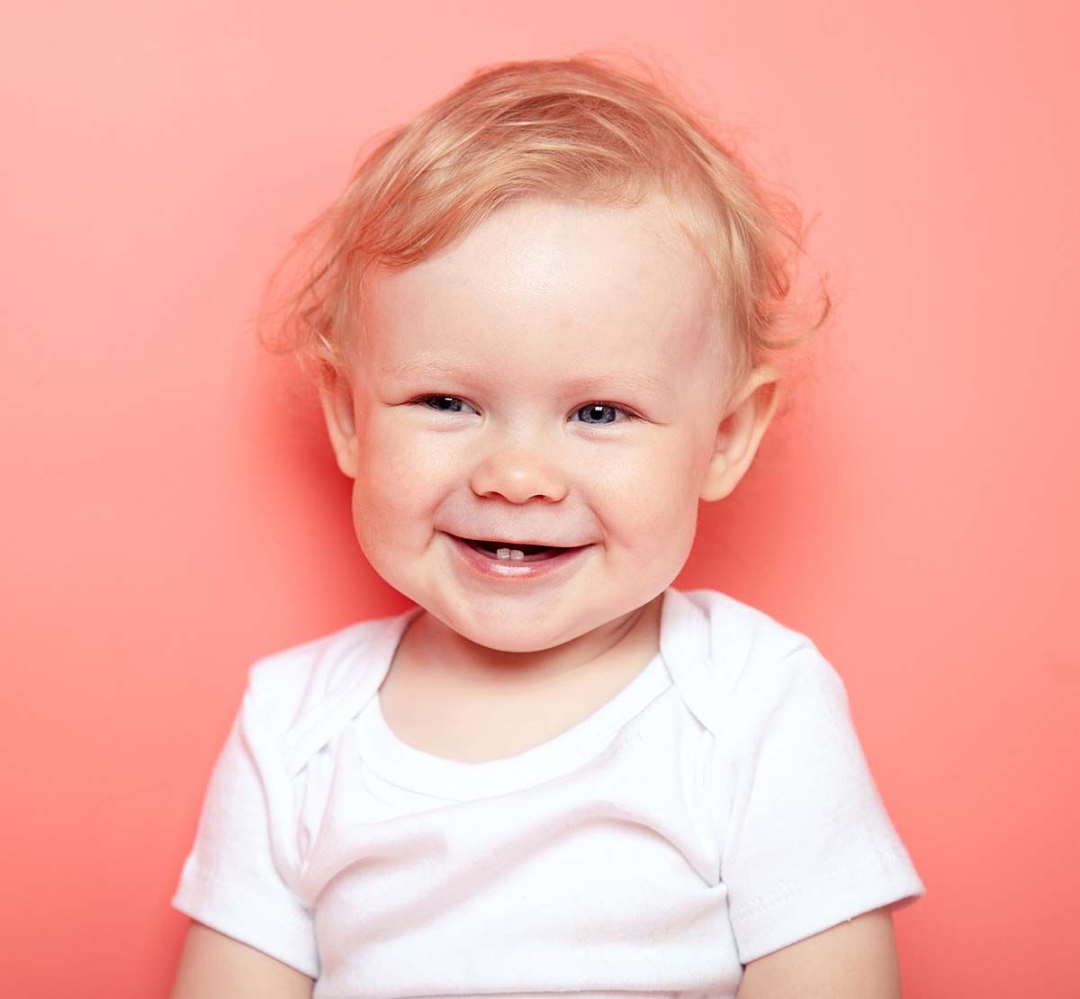 portrait caucasian curly blond smiling baby girl